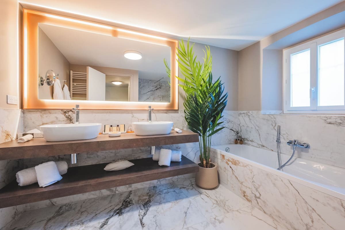 double room (duplex) | bathroom | rainfall showerhead, bathrobes, slippers, towels