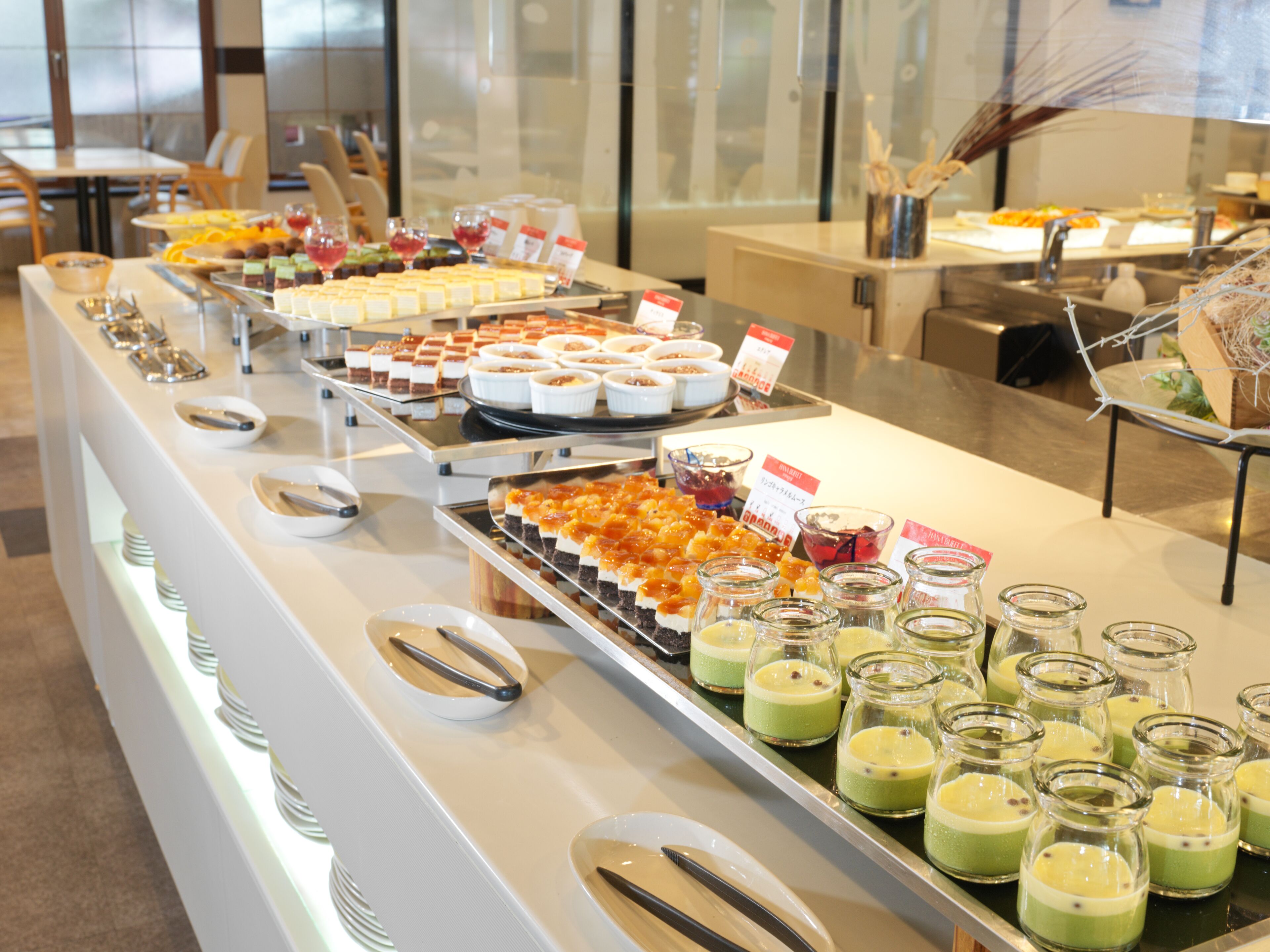 A buffet with various food items and beverages.