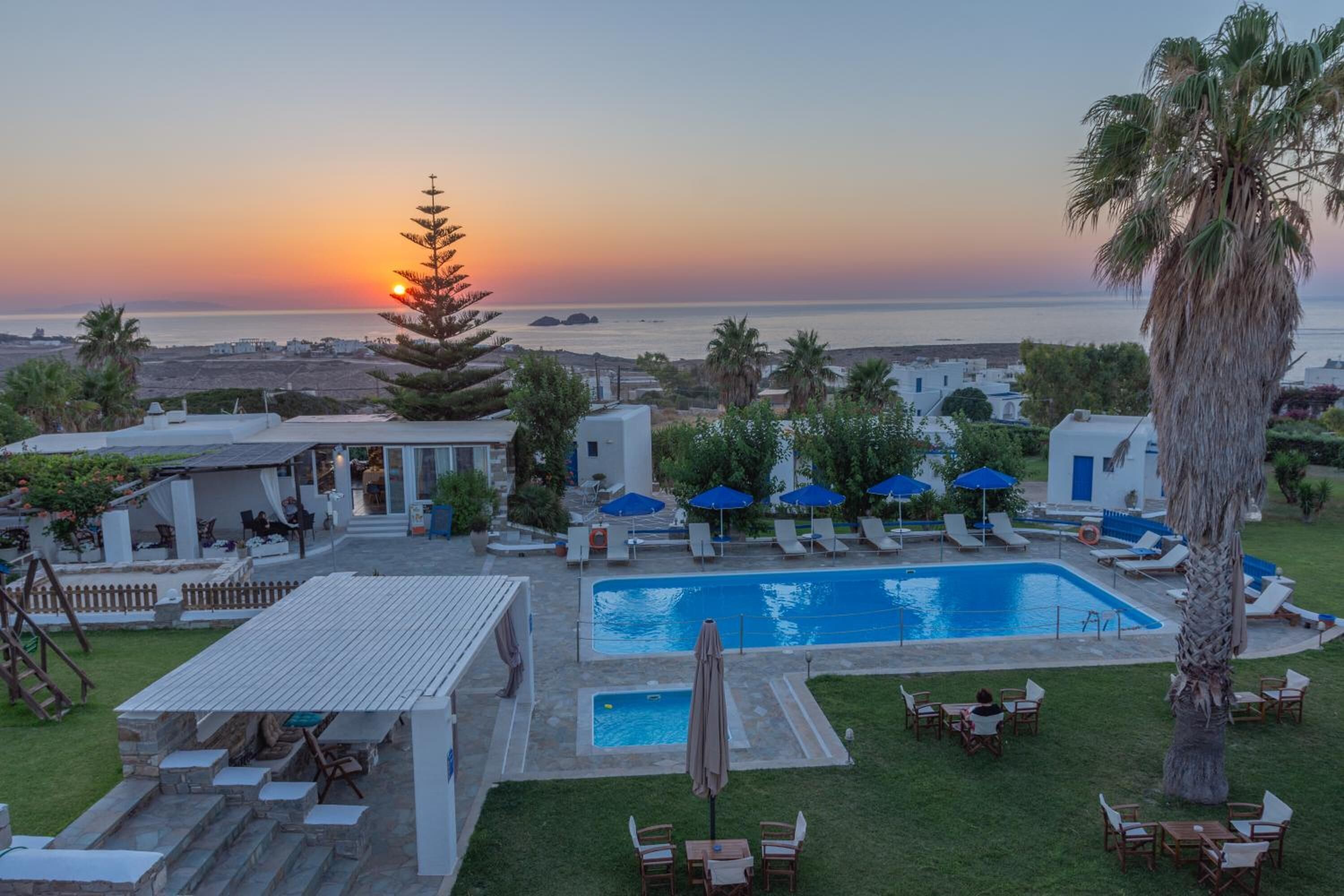 seasonal outdoor pool, open 9 am to 8:30 pm, pool umbrellas