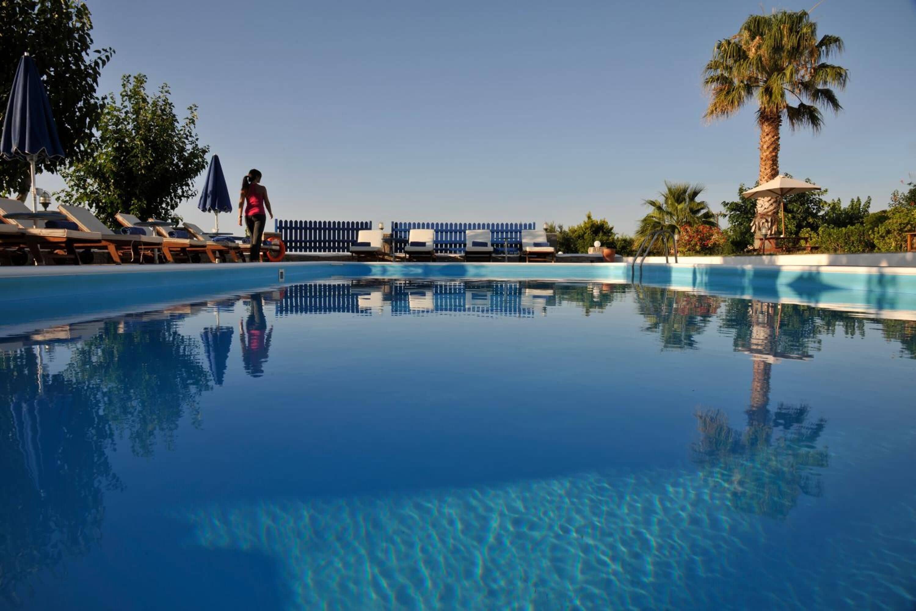 seasonal outdoor pool, open 9 am to 8:30 pm, pool umbrellas