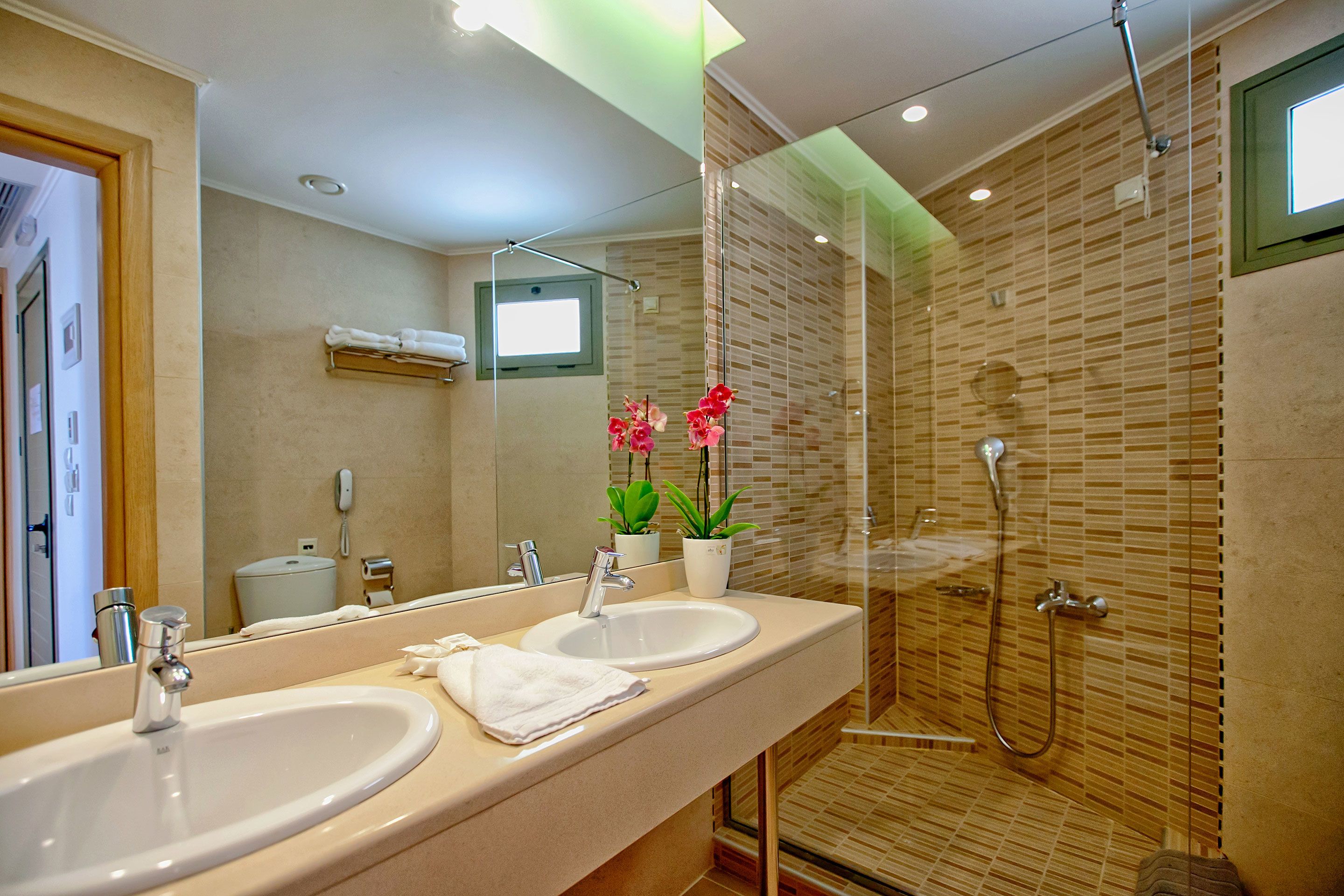 grand suite | bathroom | combined shower/bathtub, rainfall showerhead, designer toiletries