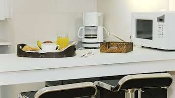 Fridge, microwave, coffee/tea maker, cookware/dishes/utensils