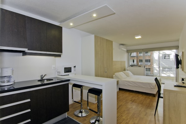 Fridge, microwave, coffee/tea maker, cookware/dishes/utensils