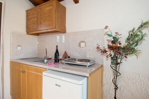 Fridge, coffee/tea maker, cookware/dishes/utensils