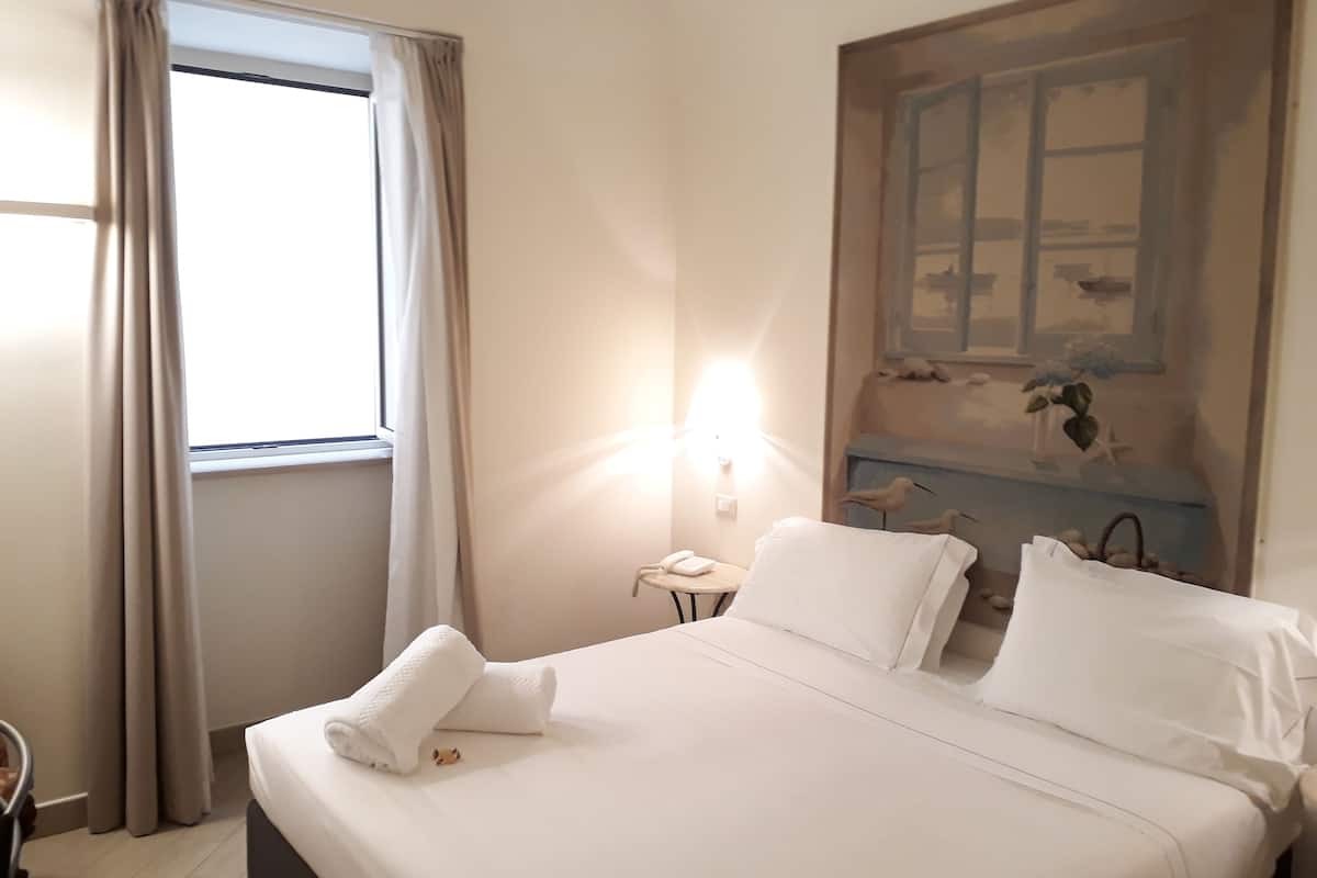 Premium bedding, down comforters, minibar, in-room safe