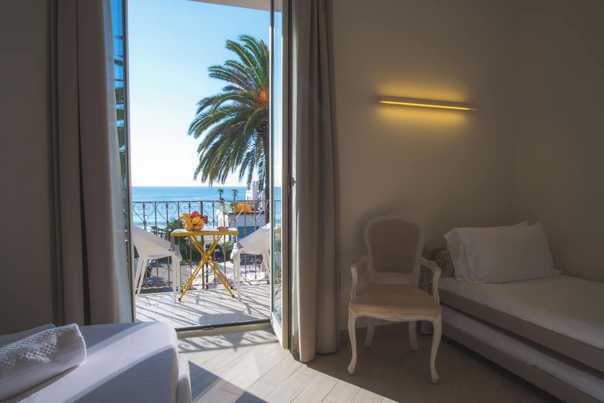 Deluxe Room, Balcony, Sea View | Premium bedding, down comforters, minibar, in-room safe