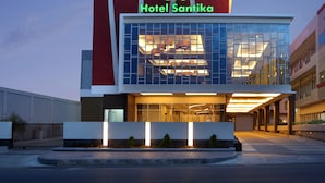 A modern hotel with a prominent sign reading "Hotel Santika." - Hotel Santika Bengkulu (Bengkulu)