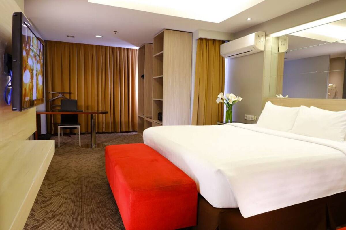 Suite ejecutiva | Ropa de cama de alta calidad, camas con pillow-top y minibar