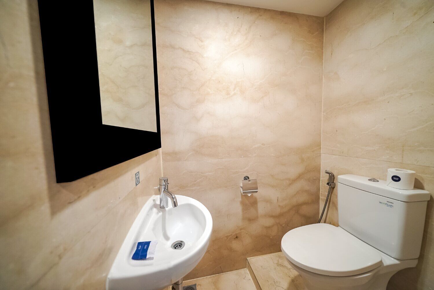 A bathroom with a sink, toilet, and shower.