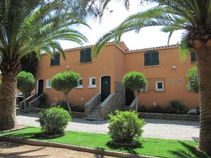 A building with a stone staircase leading to a door marked with the number 9. - Les Belles Ombres (Cargese)