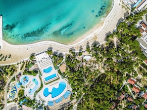 An aerial view of a resort with a beach, swimming pools, and a landscaped area. - Zaton Holiday Resort Apartments (Nin)