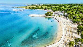 Private beach, sun-loungers, beach umbrellas, beach massages