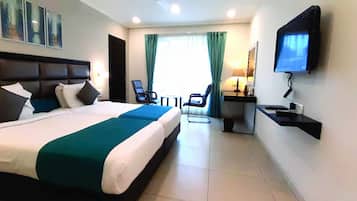 Deluxe Room, 1 King Bed | Premium bedding, minibar, in-room safe, desk