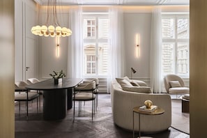 Signature Suite, 1 Bedroom | Living room | Flat-screen TV, iPod dock