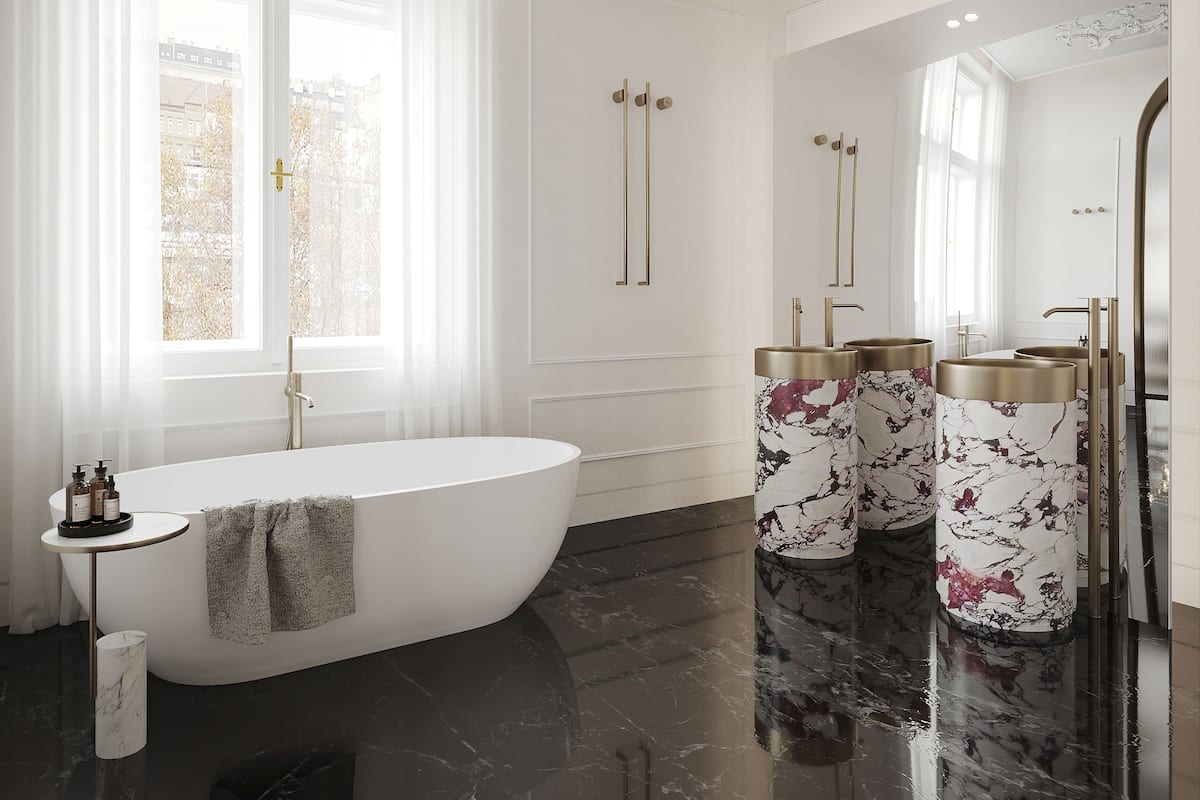 A modern bathroom with a freestanding bathtub, marble flooring, and gold fixtures.