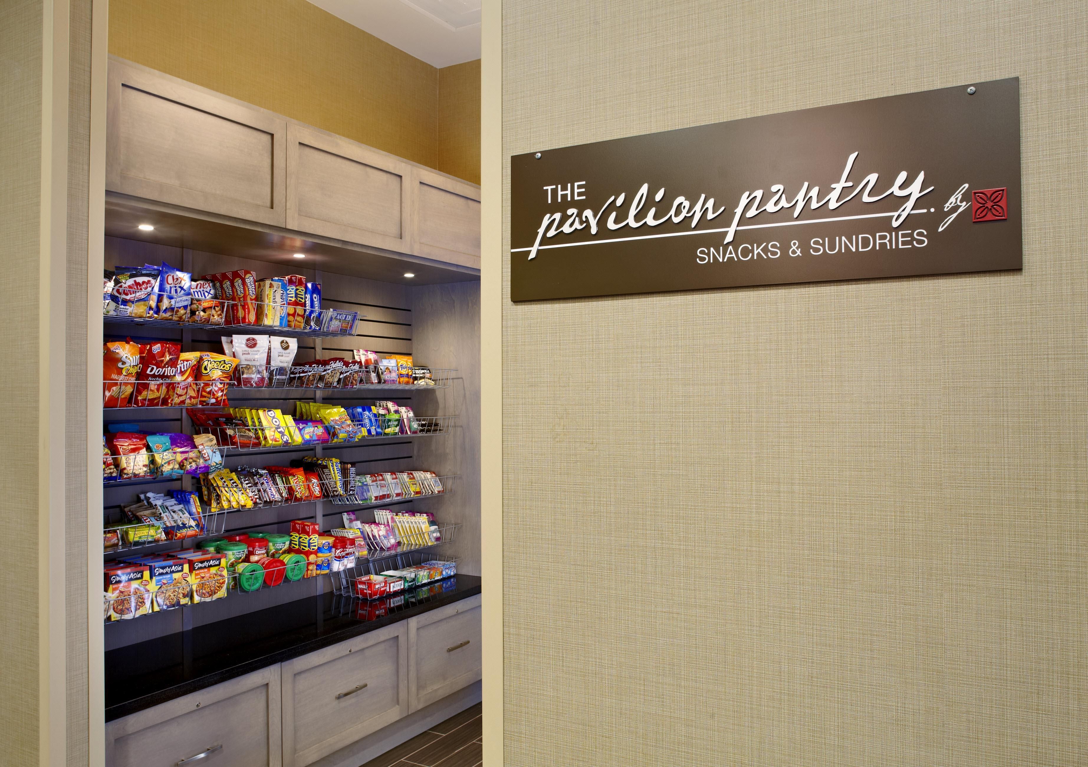 A snack and sundries section with a sign reading 'The Pavilion Pantry.'