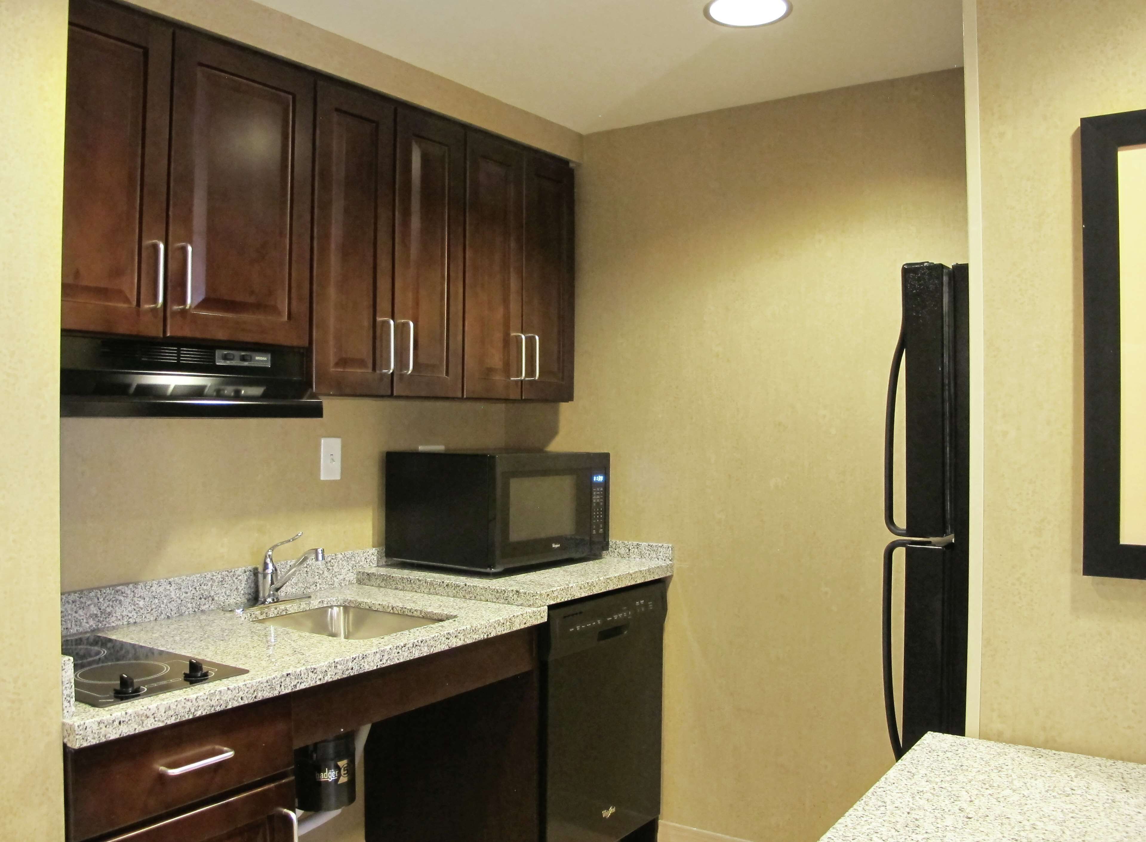 suite, 1 king bed, accessible, bathtub | private kitchen | full-sized fridge, microwave, stovetop, dishwasher