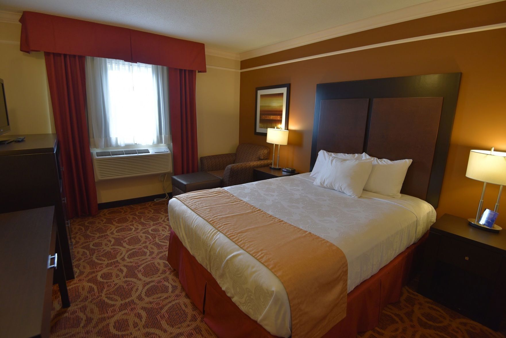 Desk, laptop workspace, blackout drapes, iron/ironing board