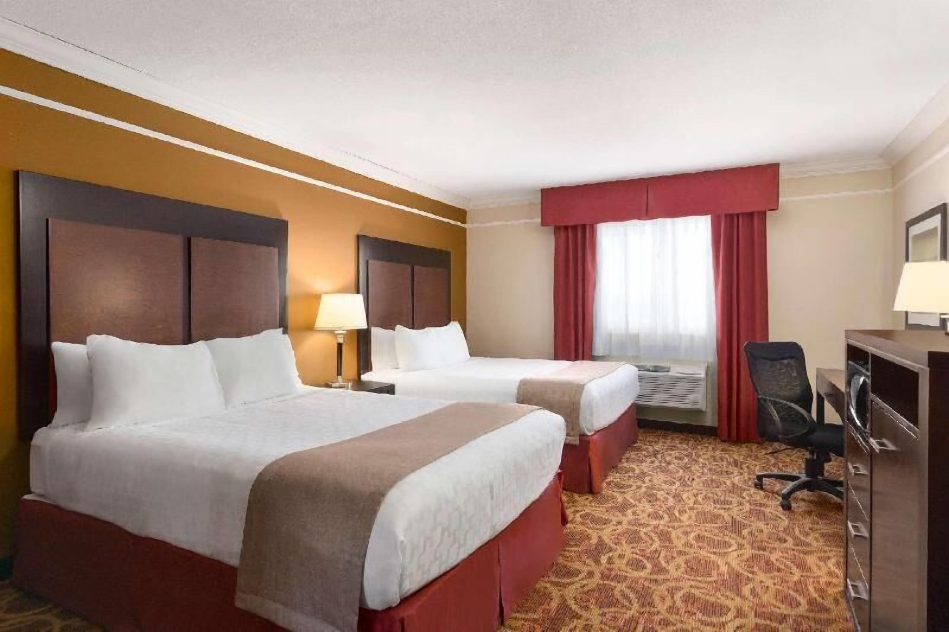 Desk, laptop workspace, blackout drapes, iron/ironing board