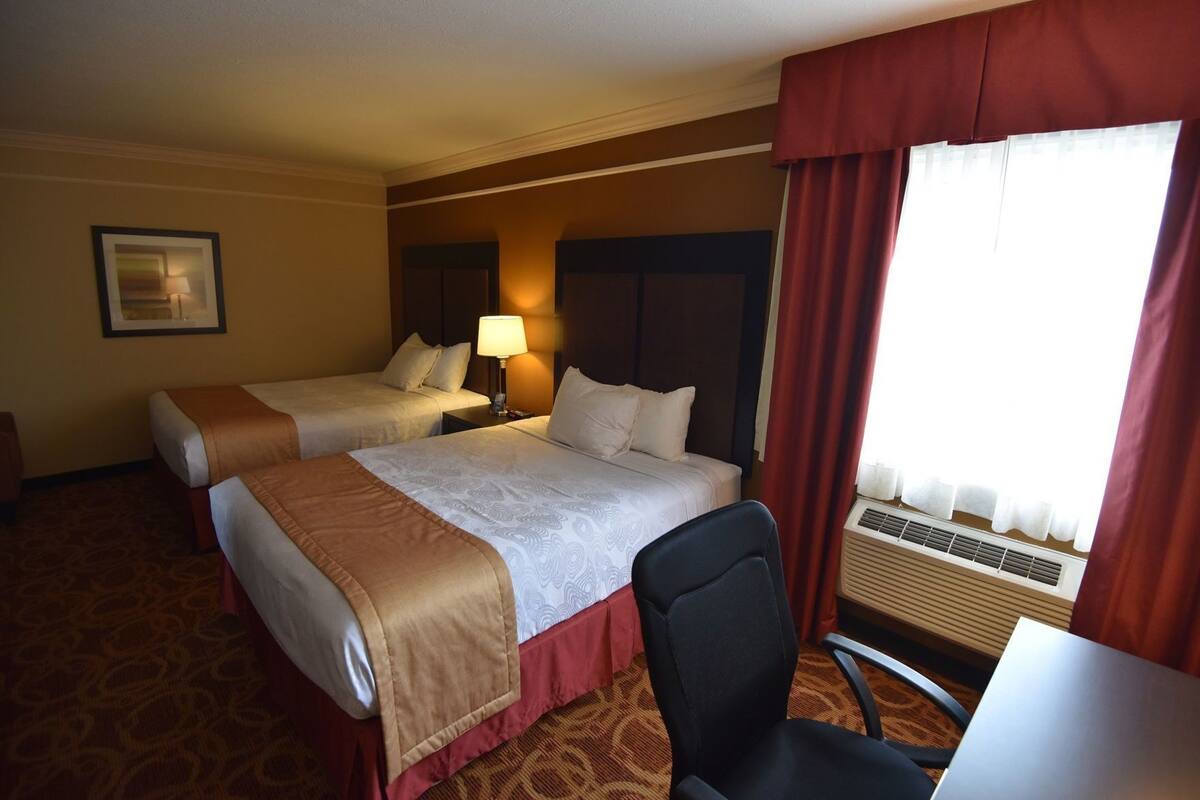 Desk, laptop workspace, blackout drapes, iron/ironing board