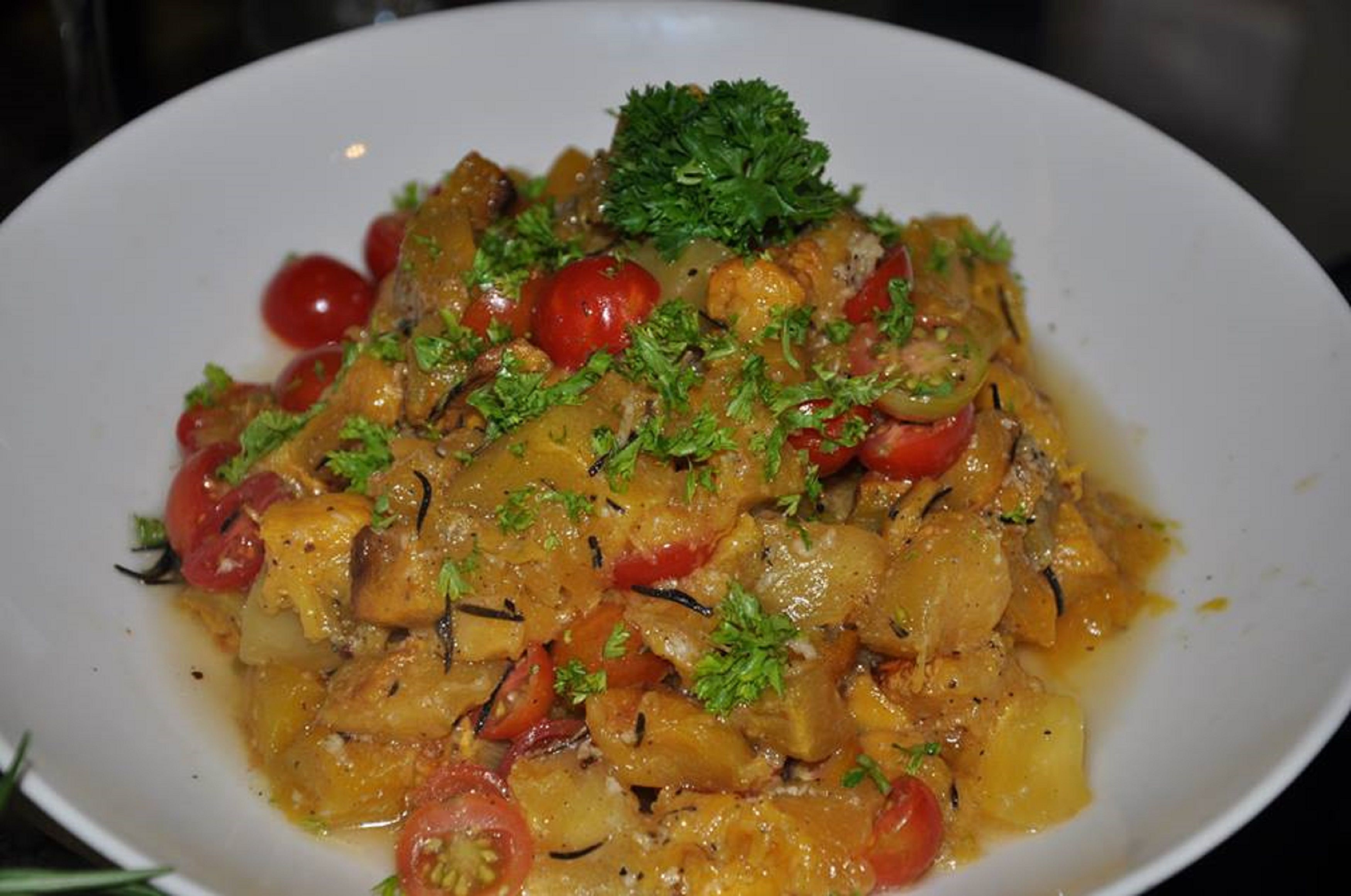 A plate of food with a garnish of parsley.