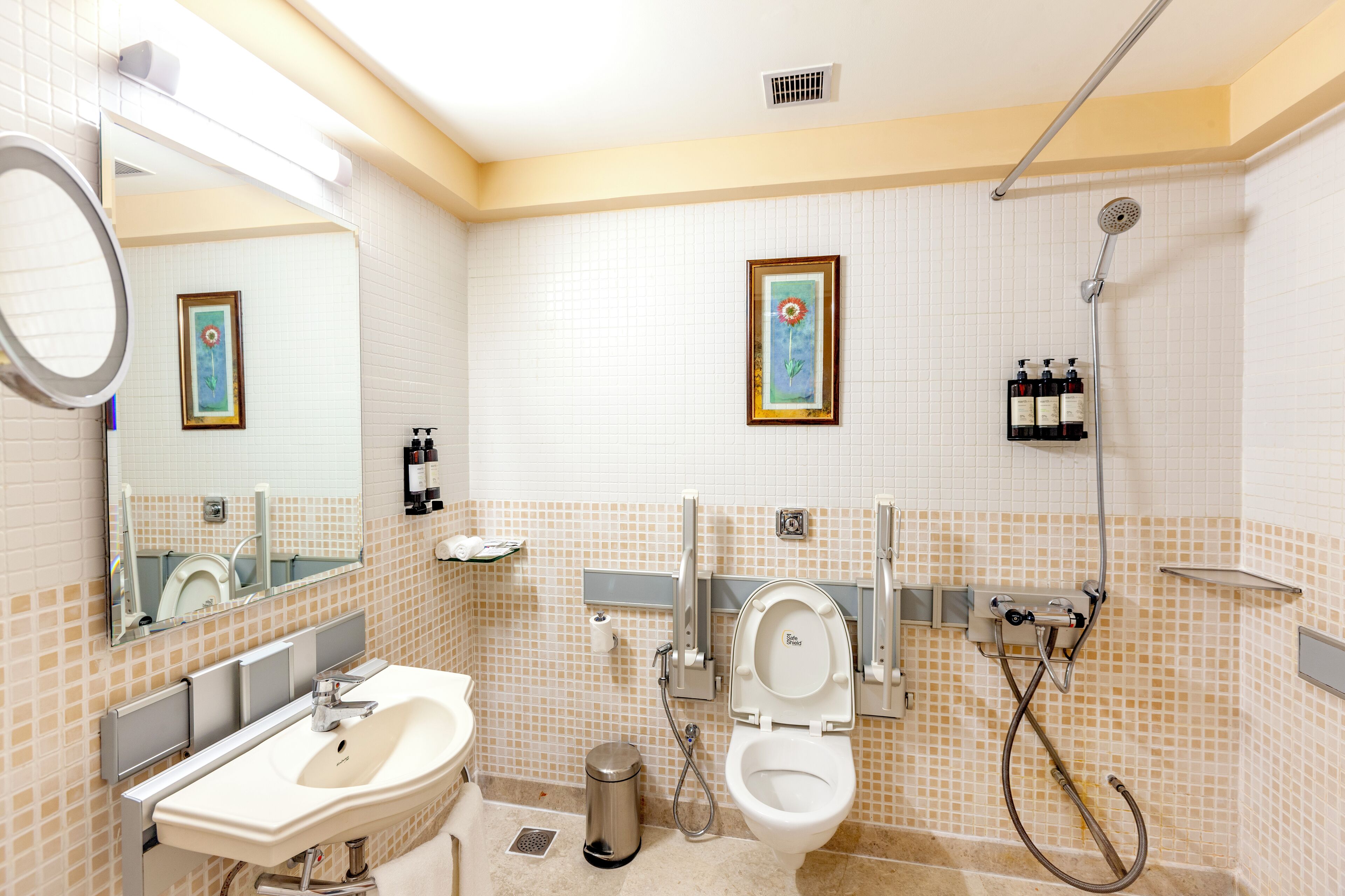 A bathroom with a sink, toilet, and shower.