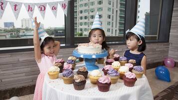 Enjoy a birthday celebration with a view in this beautifully set room.