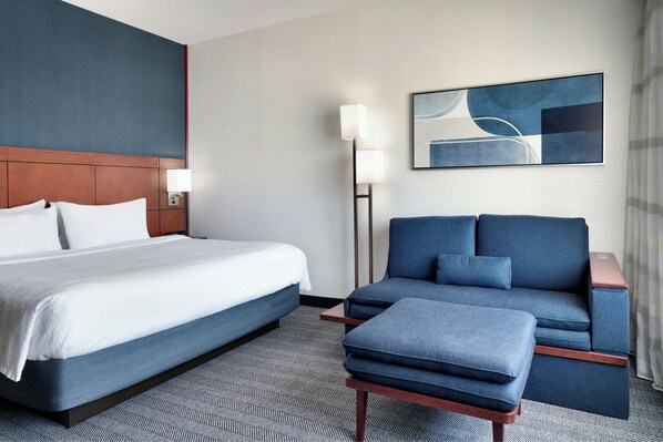 Premium bedding, desk, laptop workspace, iron/ironing board