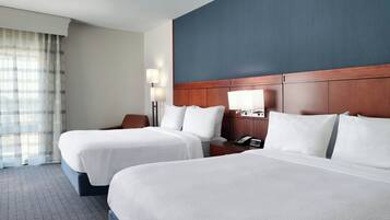 Premium bedding, desk, laptop workspace, iron/ironing board