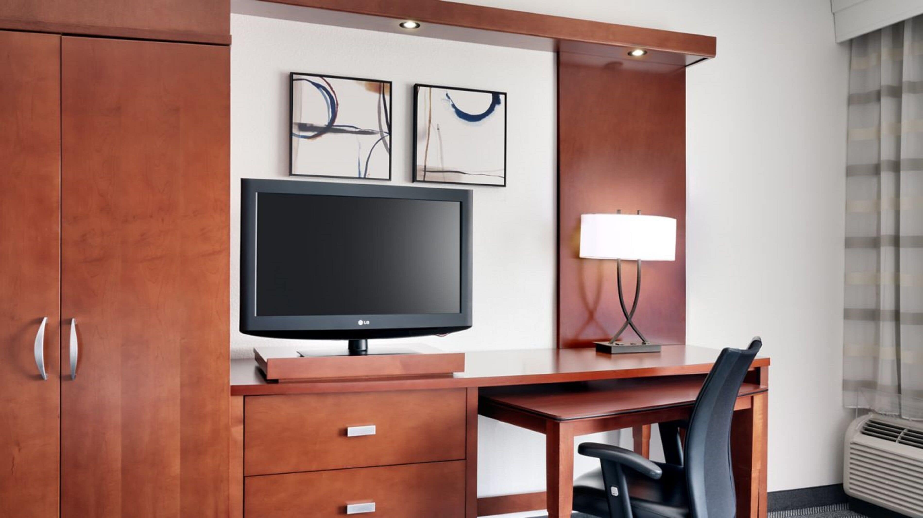 premium bedding, desk, laptop workspace, iron/ironing board