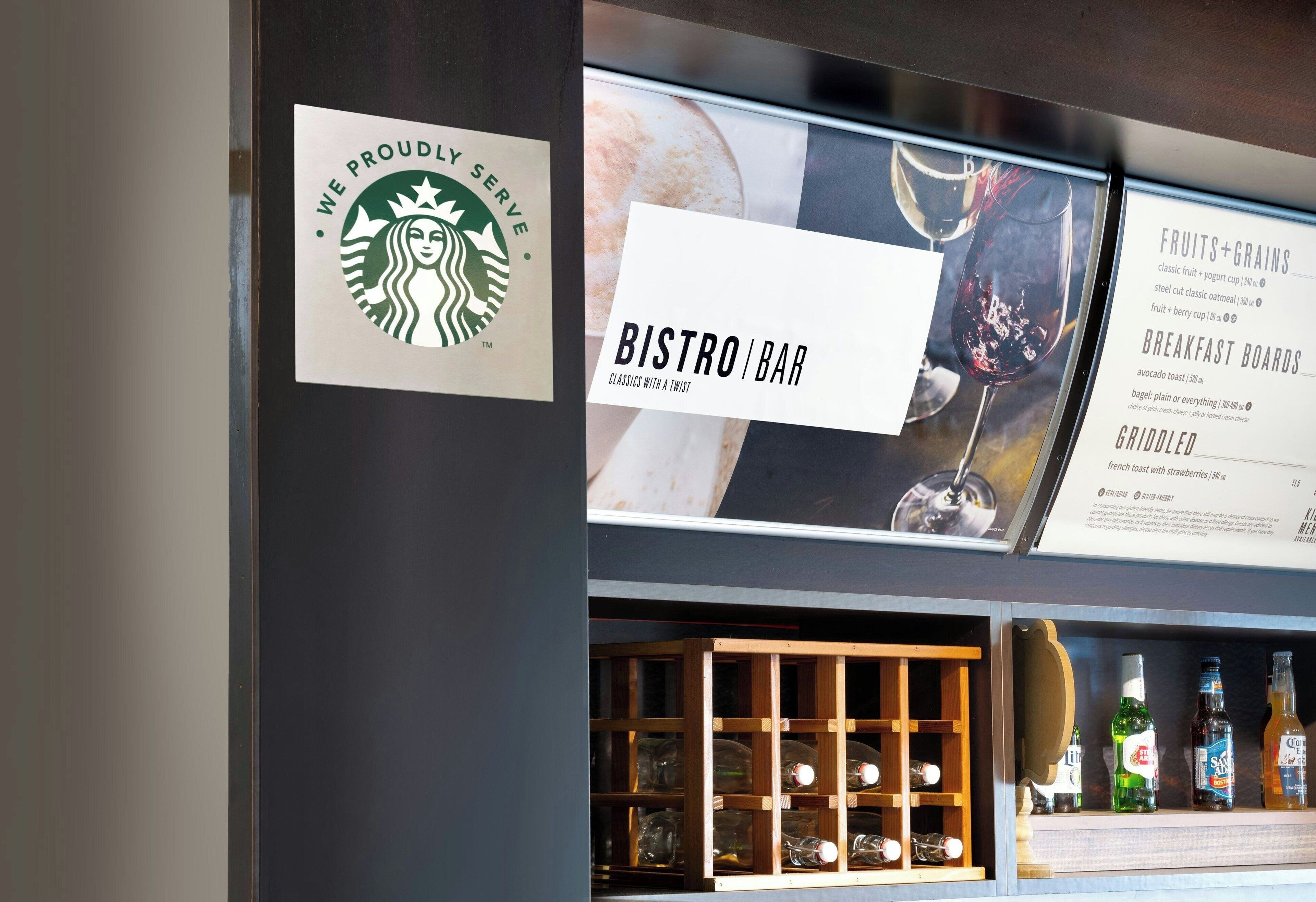A Starbucks sign, a Bistro Bar sign, and a menu board with food and drink options.