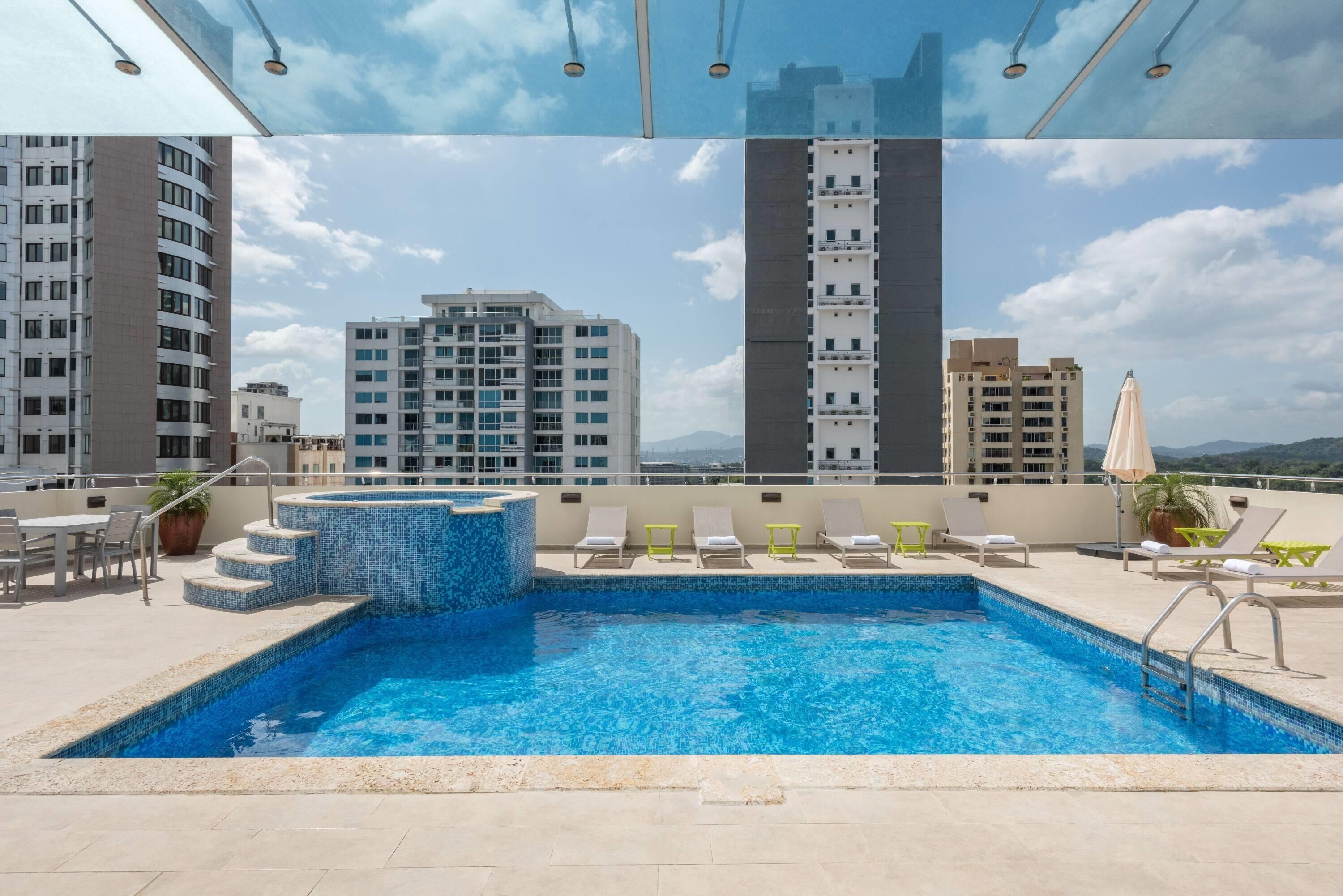 Outdoor pool, pool umbrellas, sun loungers