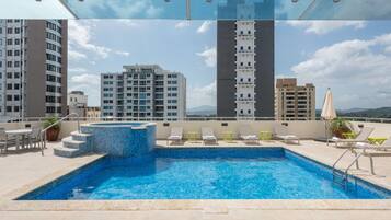 Outdoor pool, pool umbrellas, sun loungers