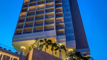 A high-rise hotel with a modern design, featuring a prominent sign for InterContinental Nha Trang.