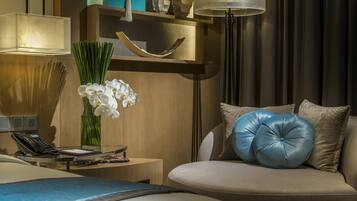 Premium bedding, down comforters, minibar, in-room safe