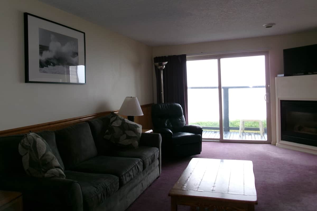 Two Bedroom Oceanfront Suite | Living area | 42-inch flat-screen TV with cable channels, TV