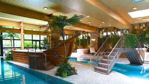 An indoor swimming pool with a wooden ship structure, stairs, and surrounding greenery. - Karuizawa Club Hotel Karuizawa 1130 / Hewitt Resort (Tsumagoi)