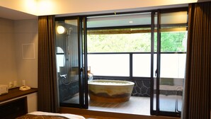 A hotel room with a large sliding glass door leading to a balcony with a hot tub. - Karuizawa Club Hotel Karuizawa 1130 / Hewitt Resort (Tsumagoi)