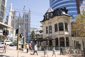 A historic building with a distinctive corner turret and large windows. - Mantra Central Wellington  (Wellington)