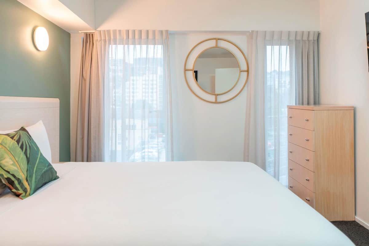 Desk, laptop workspace, iron/ironing board, travel cot