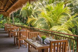 Breakfast, lunch, dinner served; Indonesian cuisine, pool views 