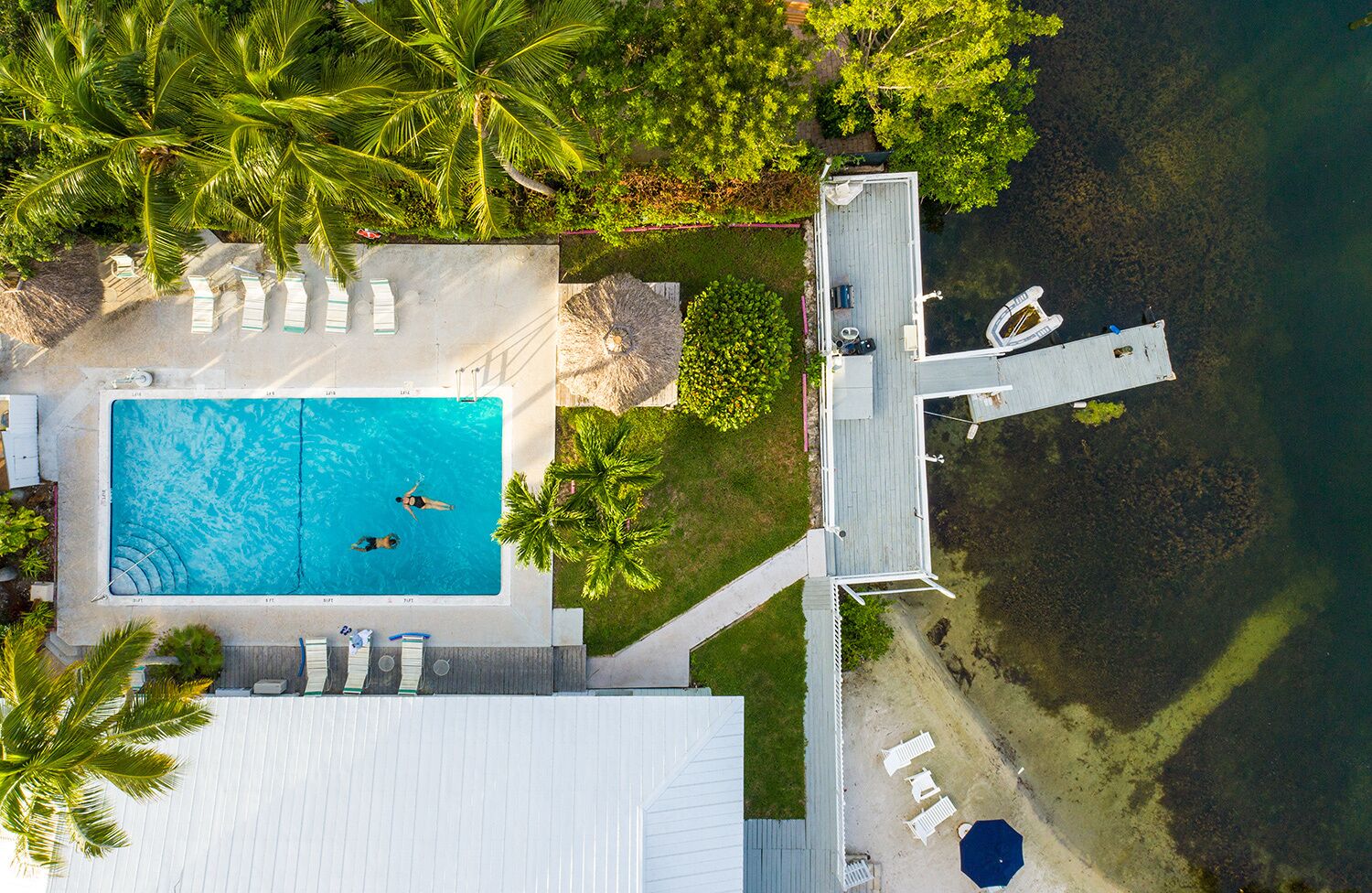 outdoor pool, a heated pool, open 9 am to 9 pm, pool umbrellas