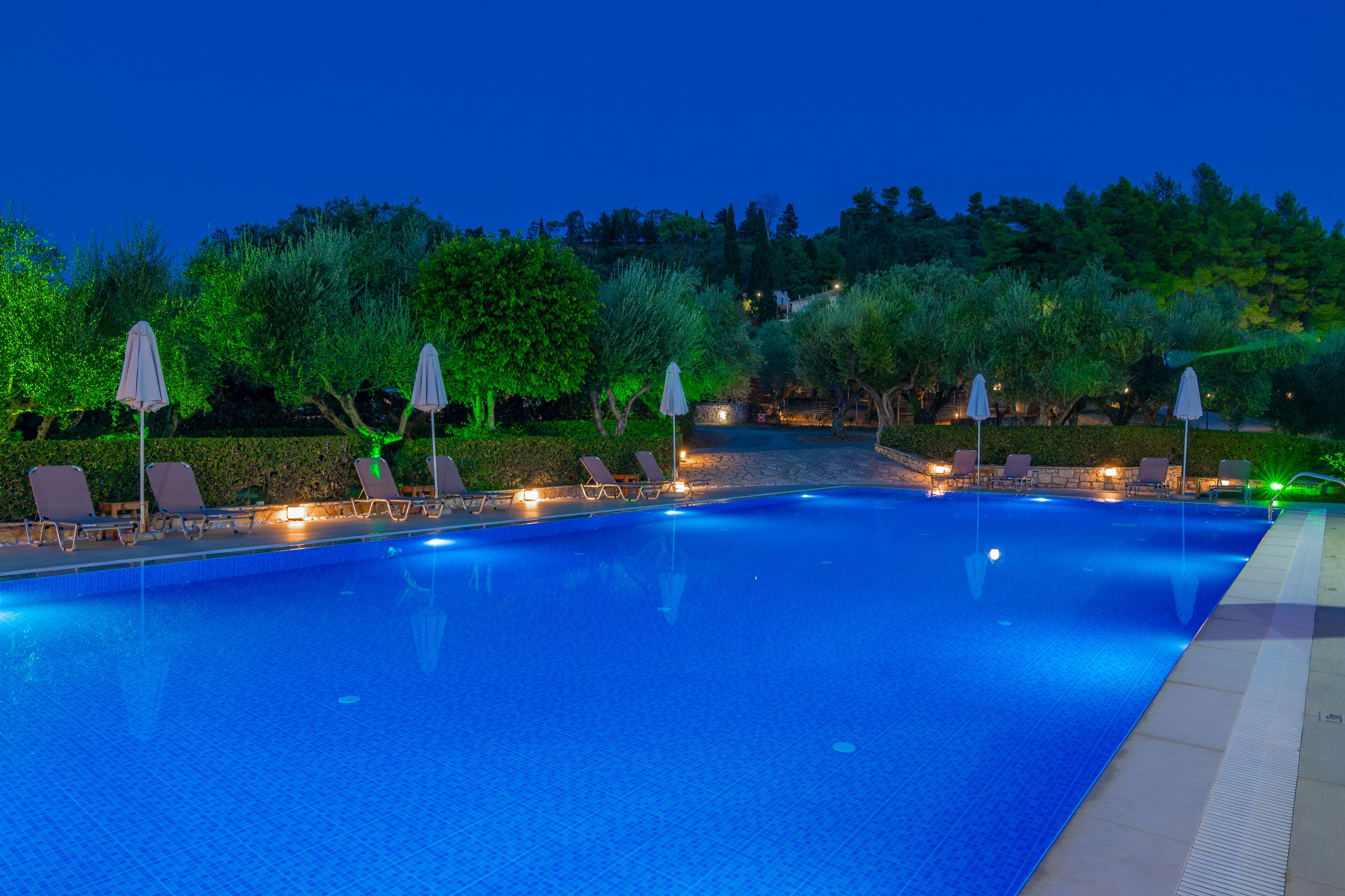 seasonal outdoor pool, open 9:00 am to 9:00 pm, pool umbrellas