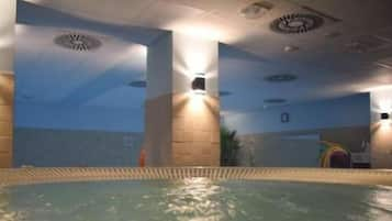 Indoor pool, open 4:00 PM to 9:00 PM, pool loungers