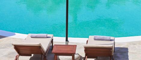 Seasonal outdoor pool, open 10:00 AM to 8:00 PM, pool umbrellas