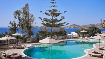 Seasonal outdoor pool, open 10:00 AM to 8:00 PM, pool umbrellas