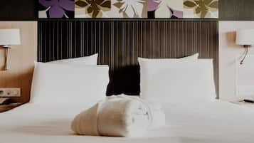 Ropa de cama de alta calidad, colchones con pillow-top y minibar