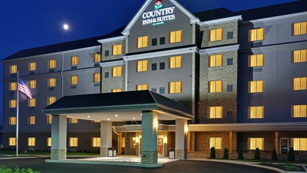 A Country Inn & Suites hotel with a prominent entrance, multiple floors, and a well-lit facade. - Country Inn & Suites by Radisson, Buffalo South I-90, NY (Buffalo)