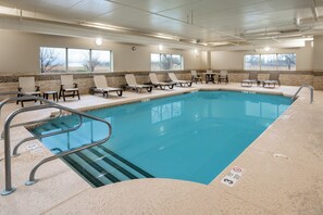 An indoor swimming pool with lounge chairs and a tiled deck. - Country Inn & Suites by Radisson, Buffalo South I-90, NY (Buffalo)