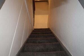 A staircase with carpeted steps leading upwards. - Abbey House Bed and Breakfast (Penrith)